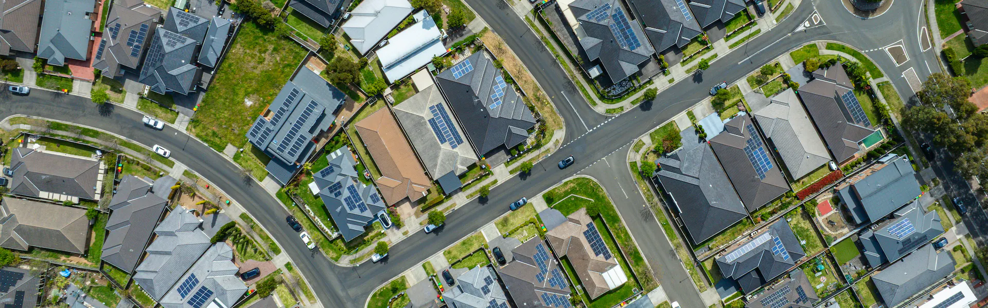 Wide angle drone daylight view of an Ottawa residential neighbourhood showcasing family homes