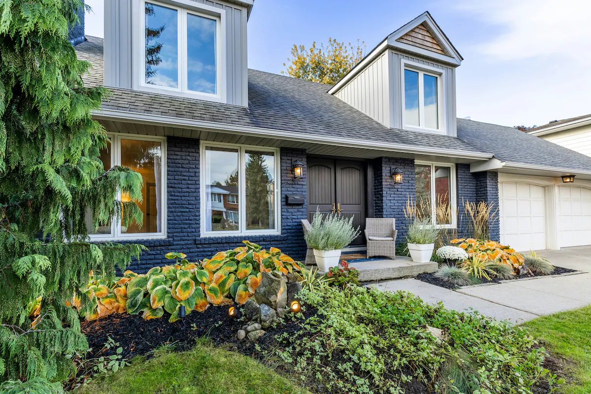 Modern fiberglass entry door with wood grain finish installed on Ottawa home